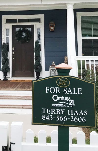 Terry Haas for sale sign in front of house
